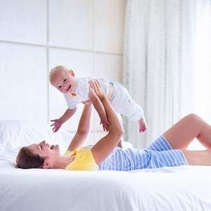 Mom Holding Happy Baby