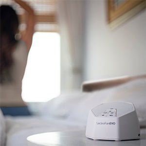 LectroFan Evo Sound Machine Infront of Woman Stretching